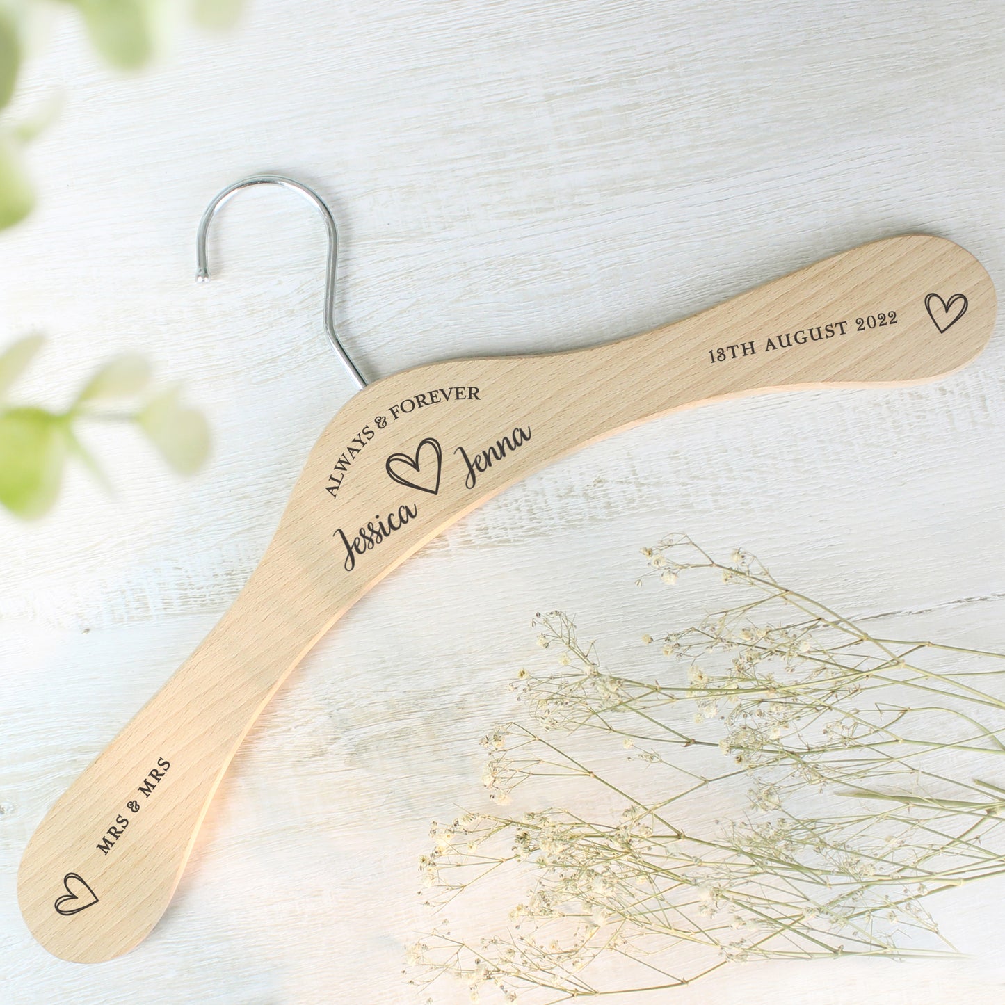 personalised wooden wedding hanger with Bride & Groom's names under the words "Always and Forever" and with a pretty sketched heart between the names. Room for further personalisation on each arm of the hanger.
