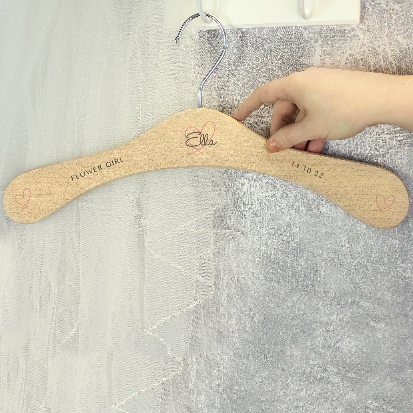 Perfect for identifying and keeping safe those special dresses. The wooden personalised wedding hanger has a pretty heart design with room for three lines of text across the hanger.
