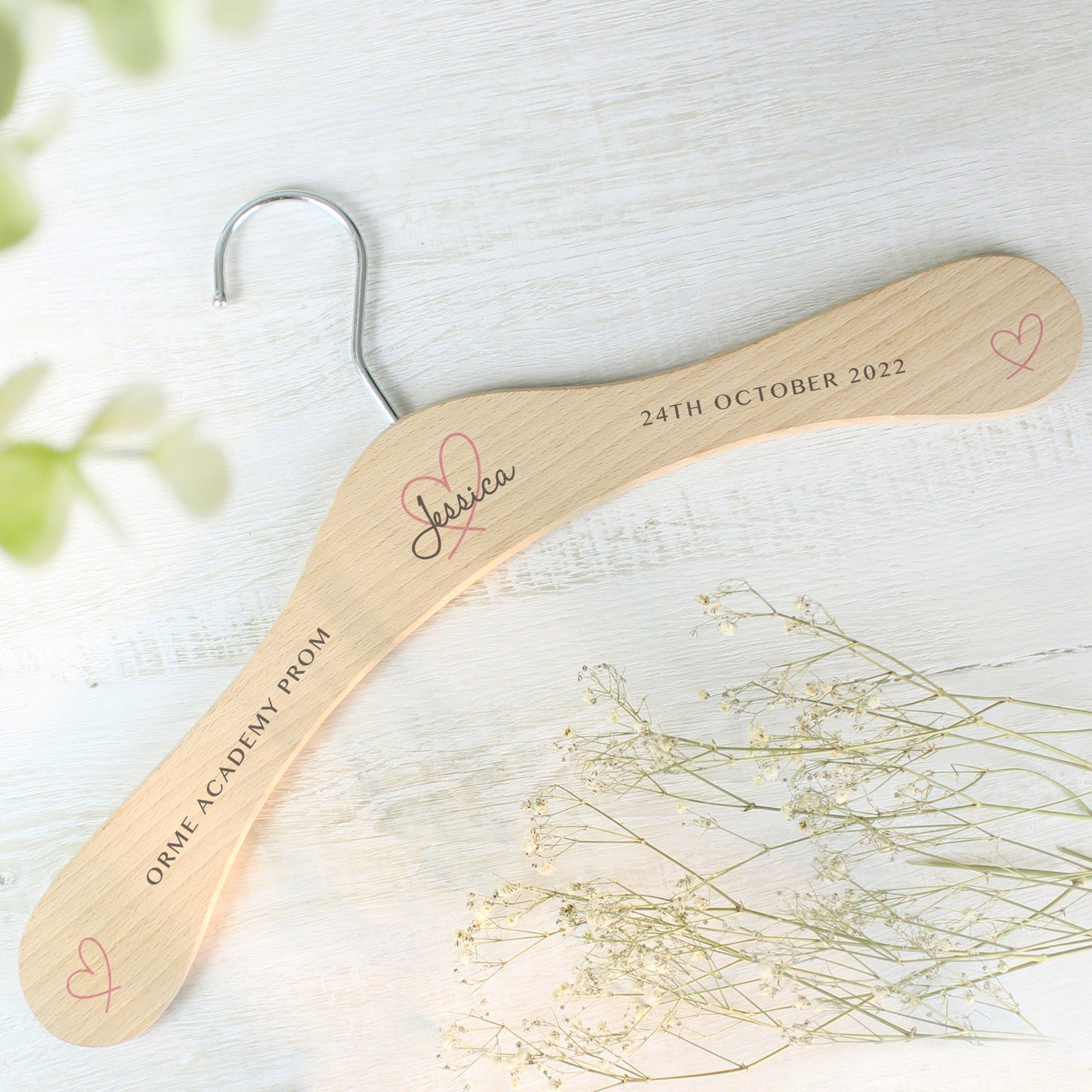Perfect for identifying and keeping safe those special dresses. The wooden personalised wedding hanger has a pretty heart design with room for three lines of text across the hanger.