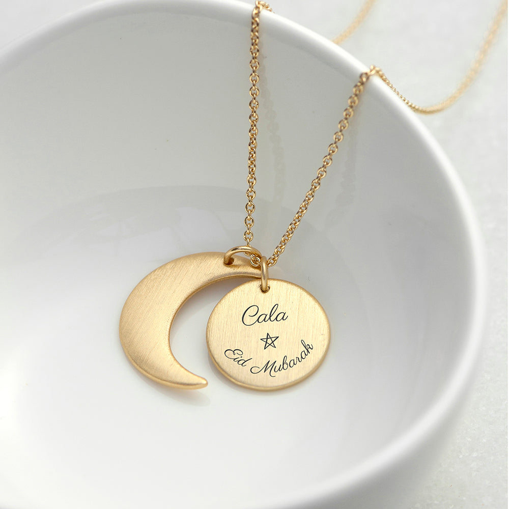 Gold plated Eid Mubarak Sun and Moon necklace. Engraved with Eid Mubarak . Personalise with engraved name.