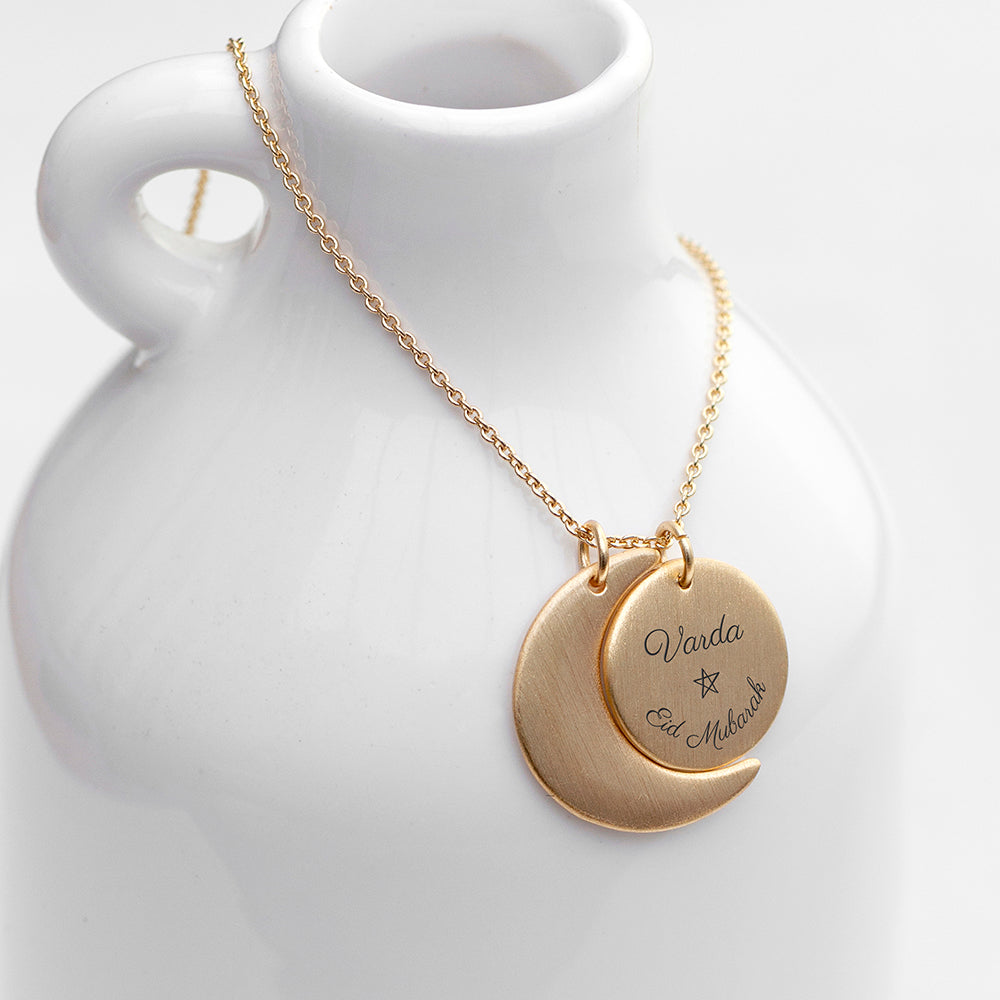 Gold plated Eid Mubarak Sun and Moon necklace. Engraved with Eid Mubarak . Personalise with engraved name.