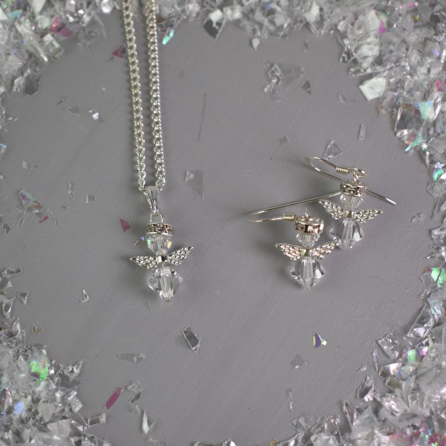 snow angel crystal pendant and earrings shown together