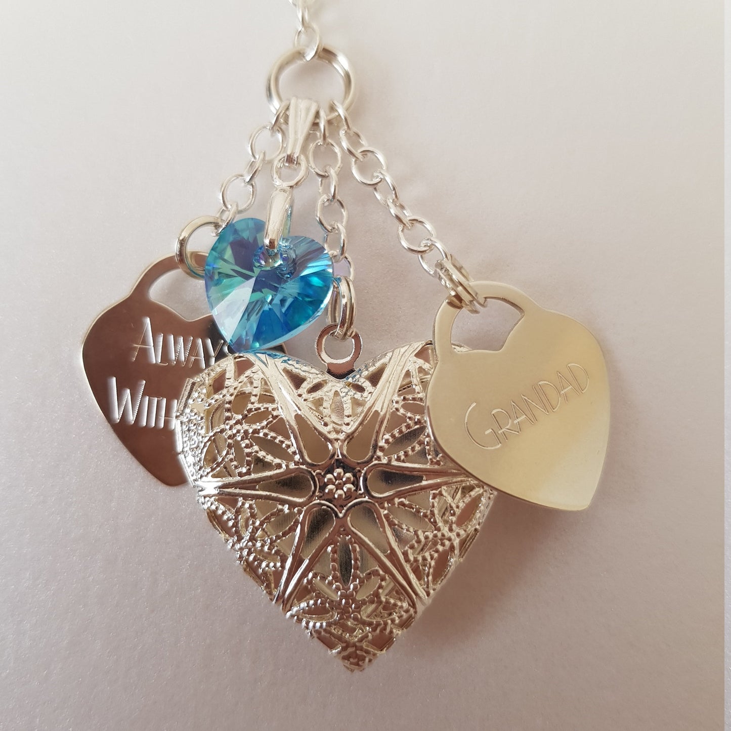 Because our wedding bouquet charm is handmade, we can customise to your choice. This charm has two engraved hearts. One saying Always With You and the other is engraved with Grandad