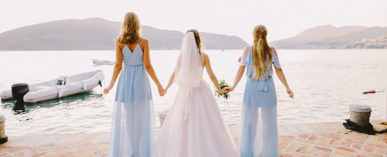 Bride and Bridesmaids holding hands