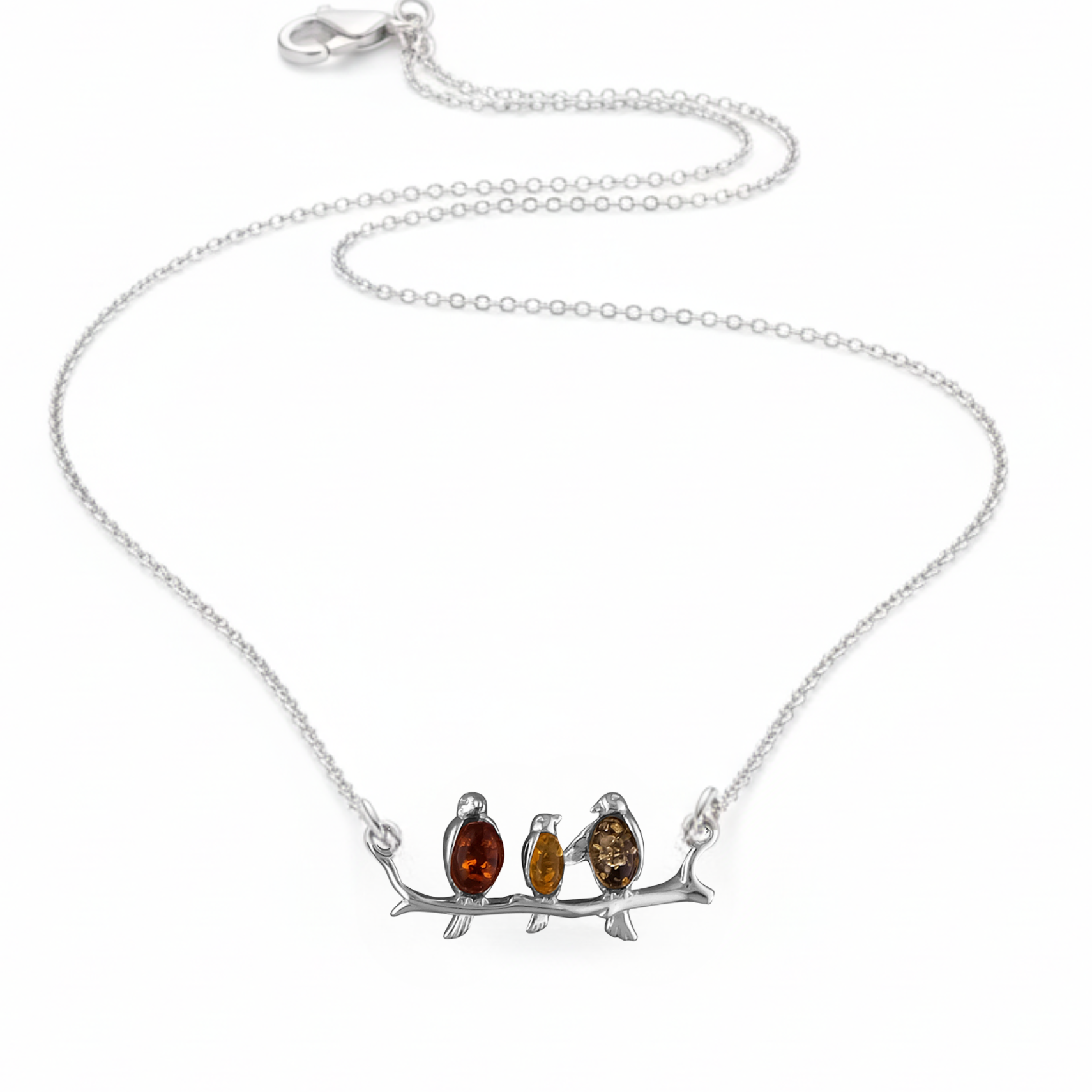 Sterling silver connector necklace showing three birds on a branch. The birds are inlaid with three types of amber - honey, cognac and olive. 