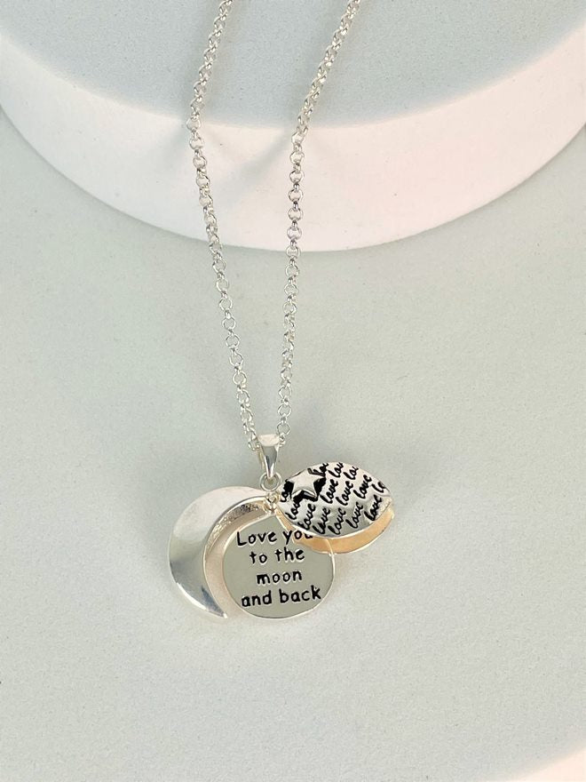 Locket shown open with the message "love you to the moon and back"
