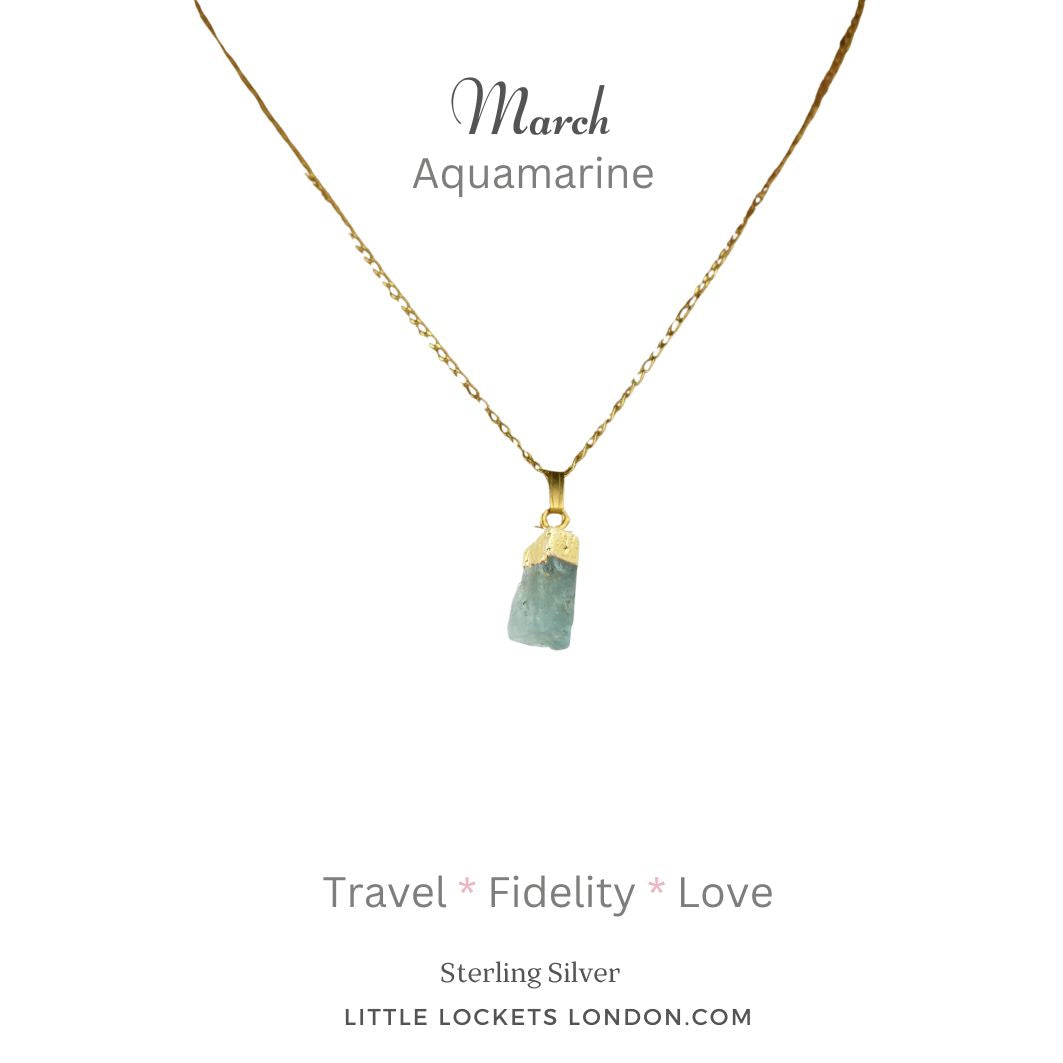 Aquamarine raw crystal with 19k gold plated sterling silver tip and chain. Mounted on card showing the birth month of March and listing three properties of the crystal - travel, fidelity, love