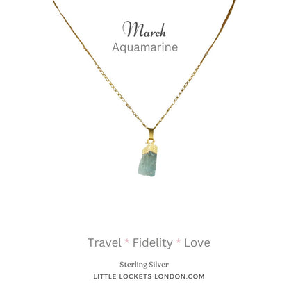 Aquamarine raw crystal with 19k gold plated sterling silver tip and chain. Mounted on card showing the birth month of March and listing three properties of the crystal - travel, fidelity, love