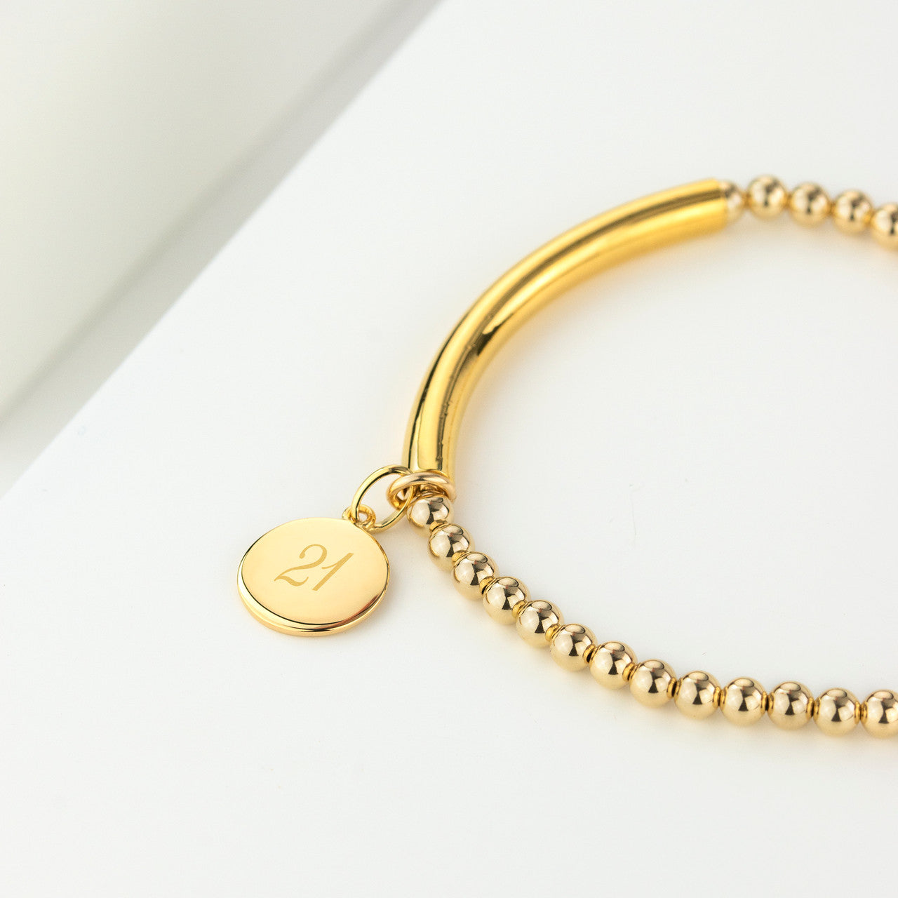 Gold filled bead and bar bracelet with engraved 21 disc