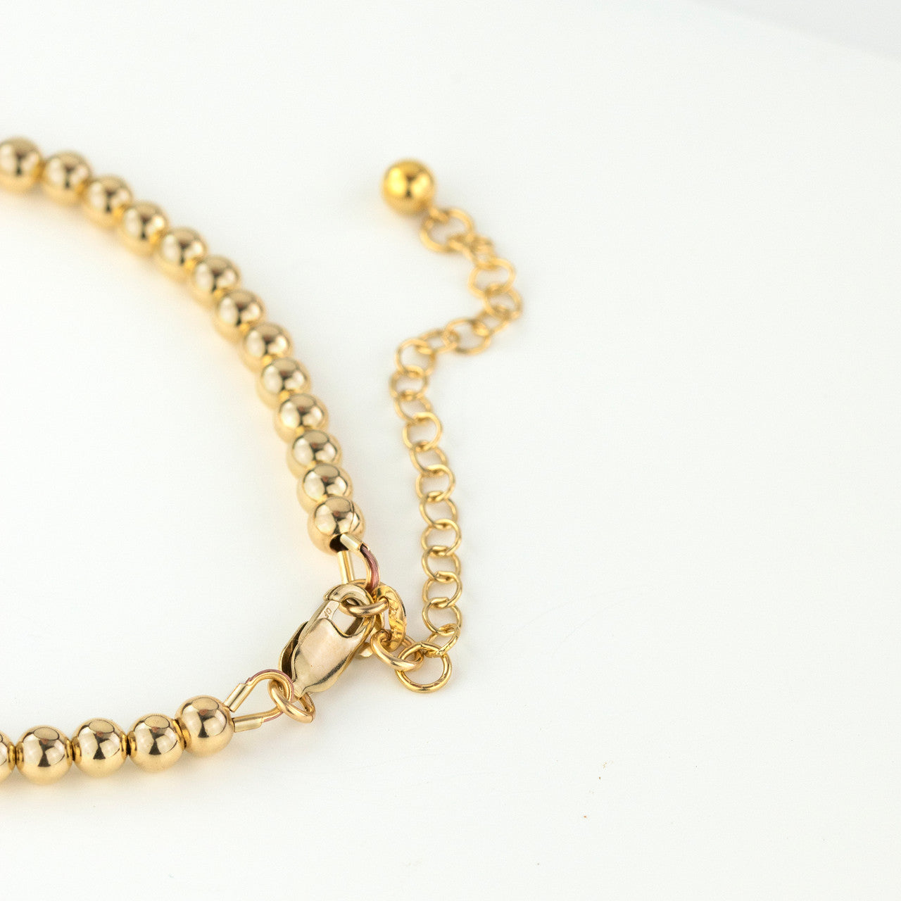 Lobster clasp and extension of gold filled bead and bar bracelet