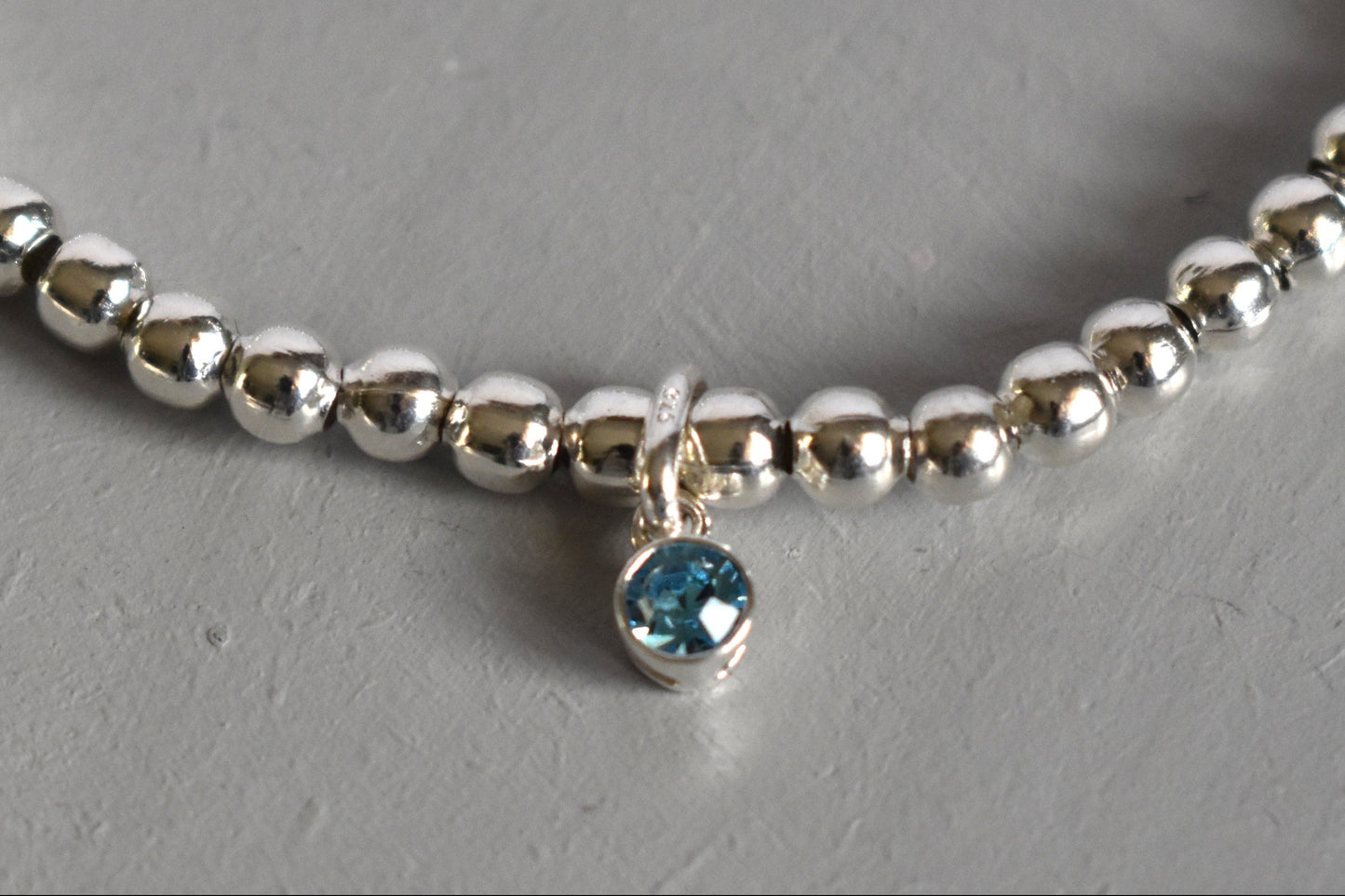 Optional sterling silver birthstone charm (aquamarine)