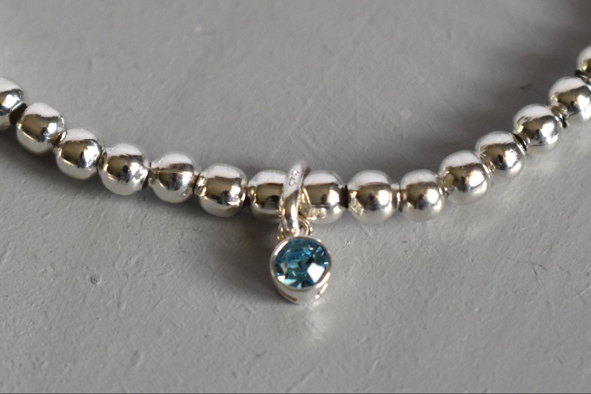 Optional sterling silver birthstone charm (aquamarine)