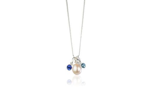 a lustrous Genuine Freshwater Pearl surrounding the pearl are delicate, sparkling high quality crystal birthstones of your choice