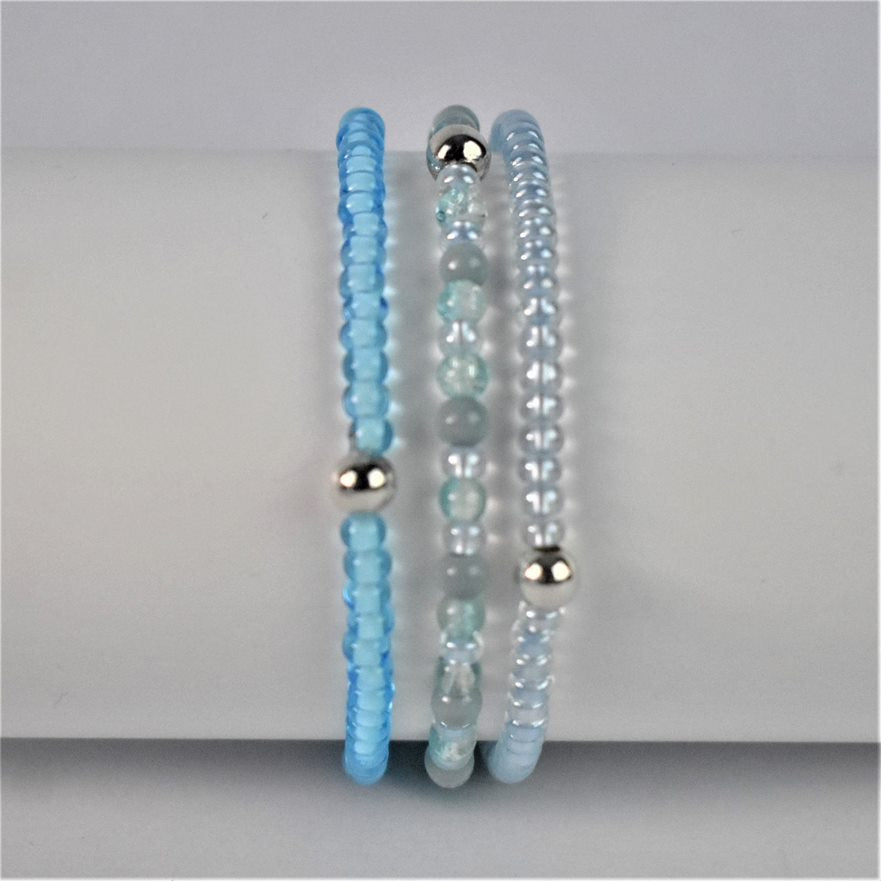 blue stacking bracelet shown with bright blue stacker and turquoise and sea green bracelet