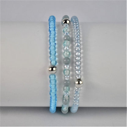 blue stacking bracelet shown with bright blue stacker and turquoise and sea green bracelet