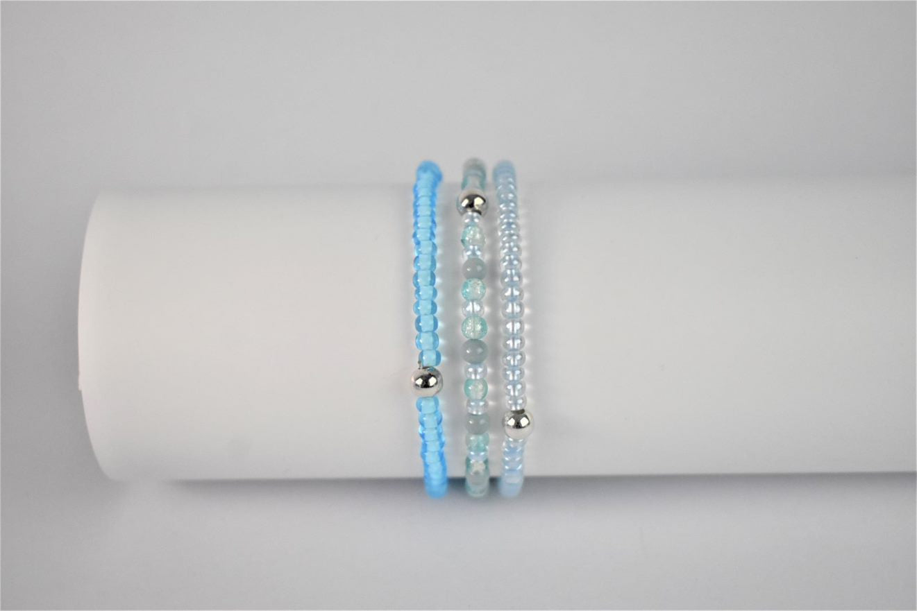 blue stacking bracelet shown with bright blue stacker and turquoise and sea green bracelet