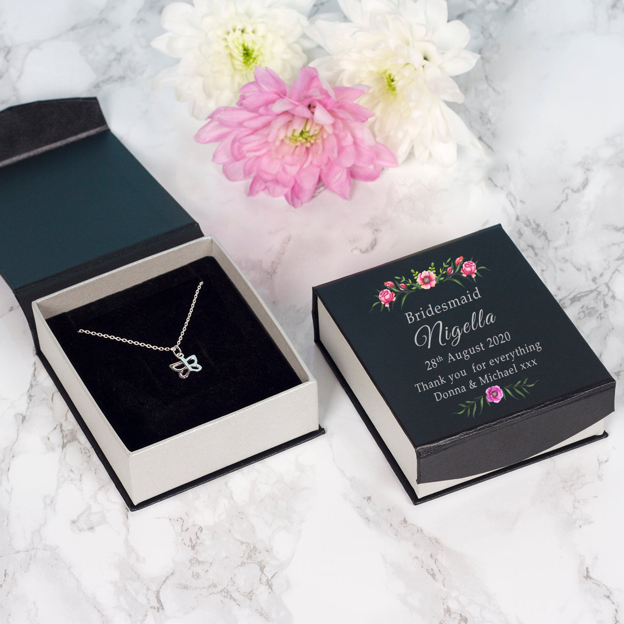 sterling silver butterfly pendant presented in a gift box showing the recipient's name, role and the date of the wedding. You can also add up to two lines of your own personal message.  Shown is the Bridesmaid box.