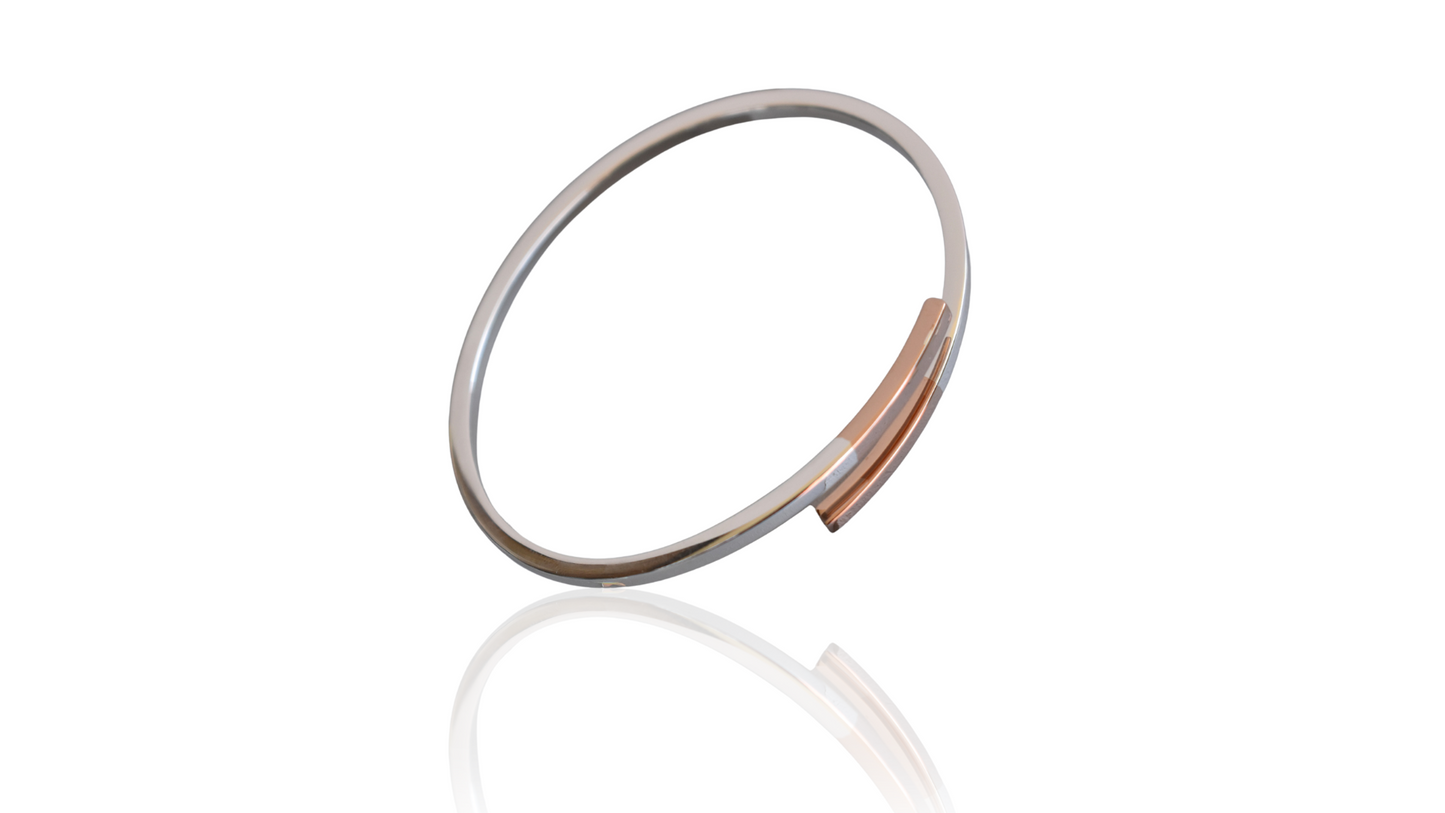 Sterling silver cross over bangle with rose gold tipped ends
