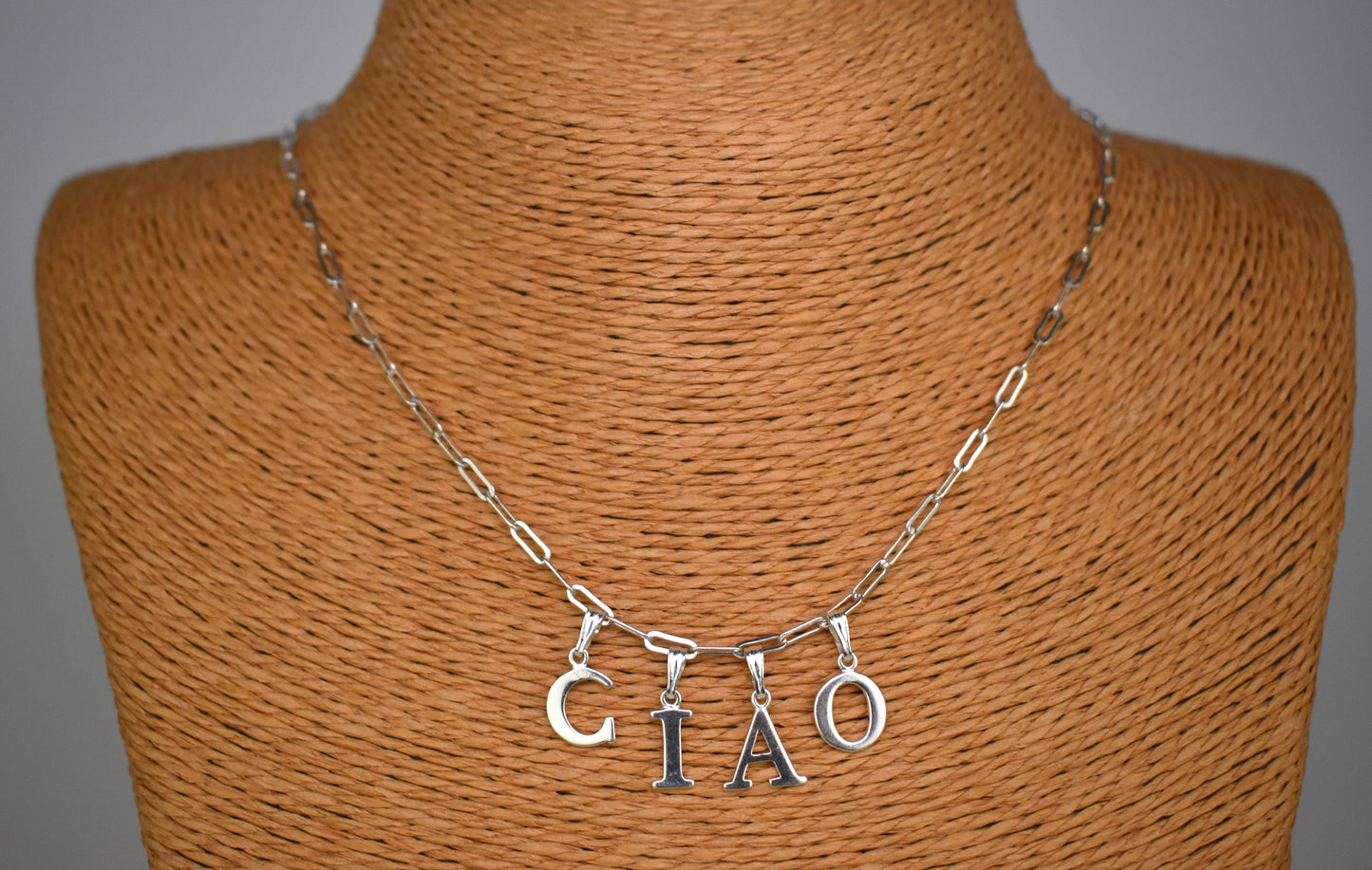 Ciao Sterling Silver Letter Necklace on a 16 inch drawn cable chain. On a bust.