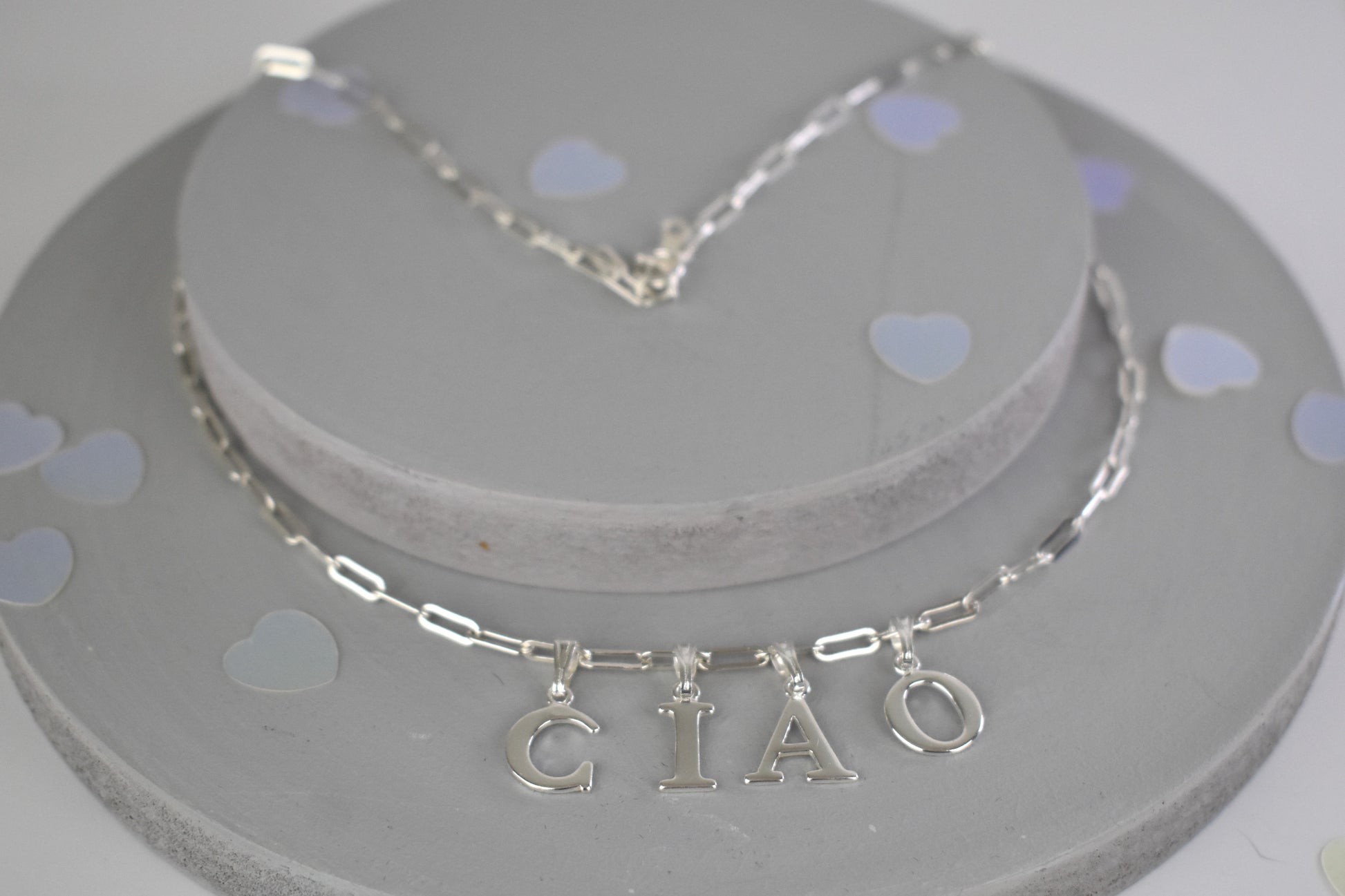 Ciao Sterling Silver Letter Necklace on a 16 inch drawn cable chain. On a bust.