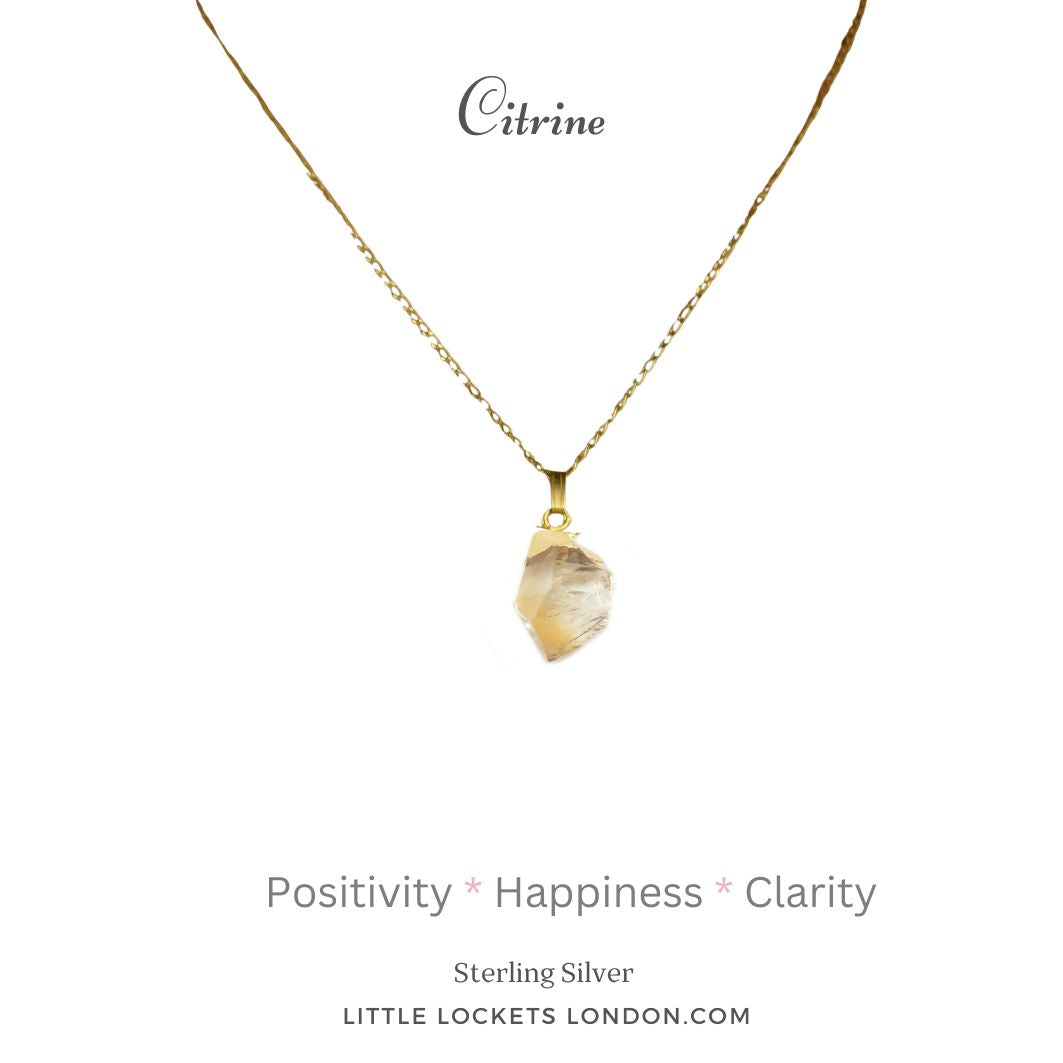 Citrine raw crystal pendant shown with sterling silver gold plated tip. Mounted on sterling silver gold vermeil chain. The pendant is shown on a cardwitht he stones name and with three of its qualities - positivity happinees and clarity