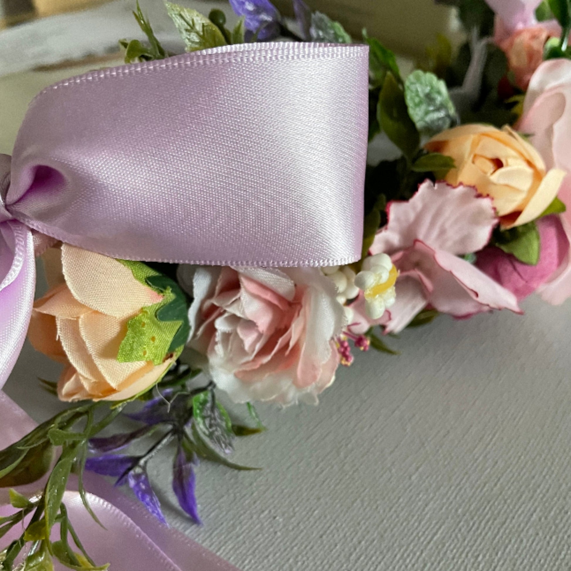 close up of Dog flower garland on leather collar lilac tones