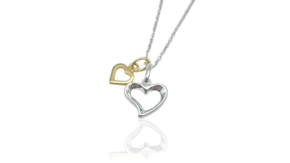 sterling silver heart with a smaller gold vermeil heart suspended from a 16-18" sterling silver chain. The necklace is placed in a small glass bottle that includes a scroll  for you to write your own message.