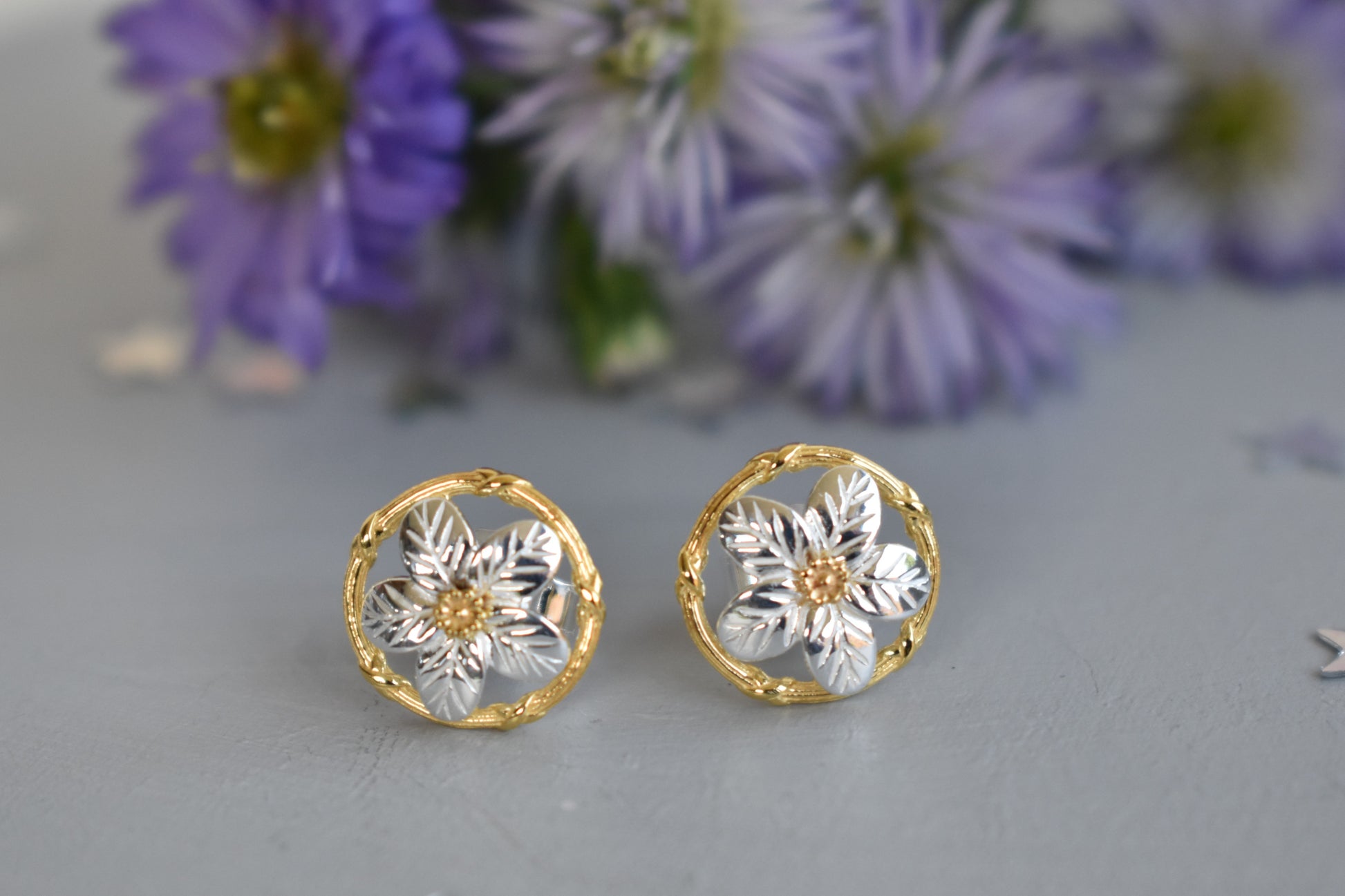Forget me not earrings made from sterling silver with gold plated accents. Stud earrings.