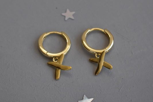 Huggie earrings to match our golden kisses necklace. 9mm  huggies gold plated on sterling silver have a "kiss" dangling from each earring.
