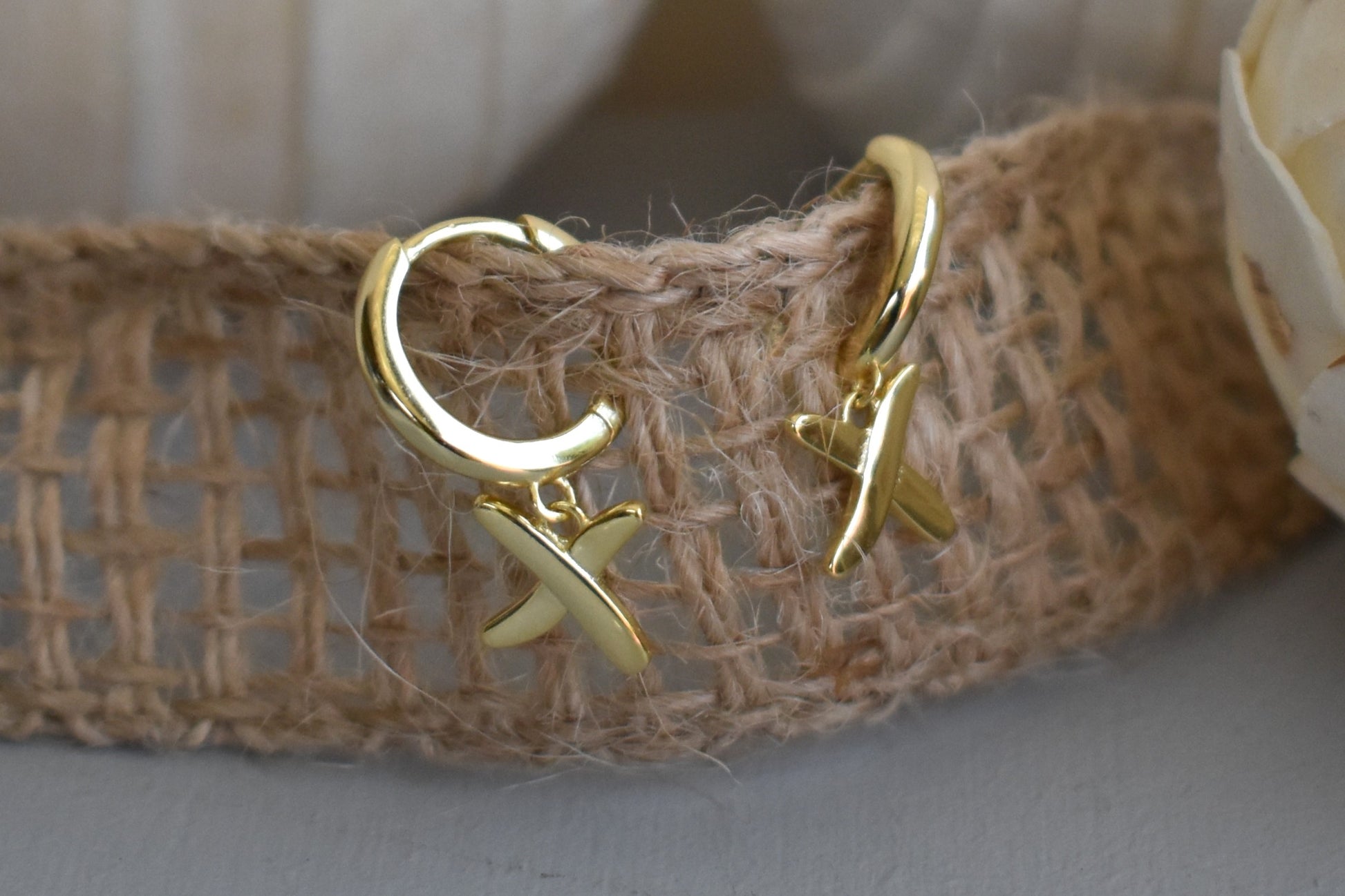 Huggie earrings to match our golden kisses necklace. 9mm  huggies gold plated on sterling silver have a "kiss" dangling from each earring.