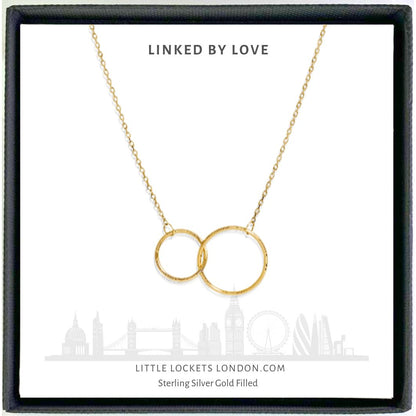 Entwined circles pendant in gold fill finish. Mounted on a message card of your choice.