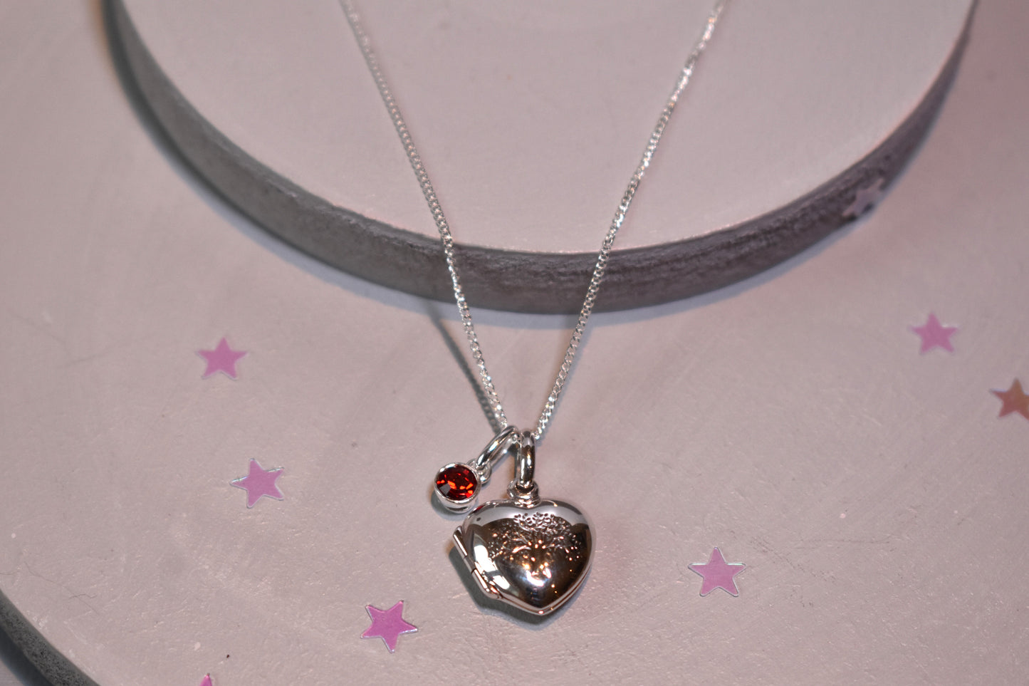 sterling silver heart shaped necklace engraved with family tree shown with optional sterling silver 4mm birthstone