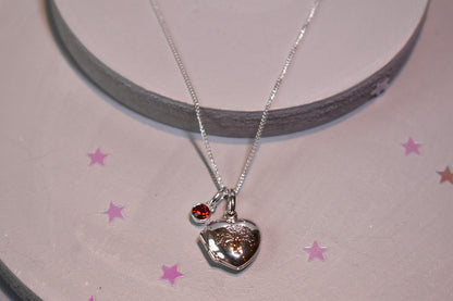 sterling silver heart shaped necklace engraved with family tree shown with optional sterling silver 4mm birthstone