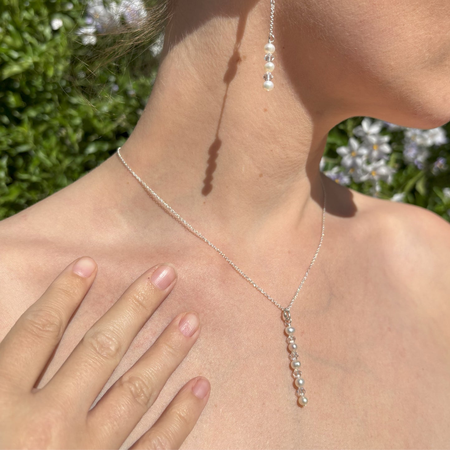 A pearl and crystal necklace  with matching earrings