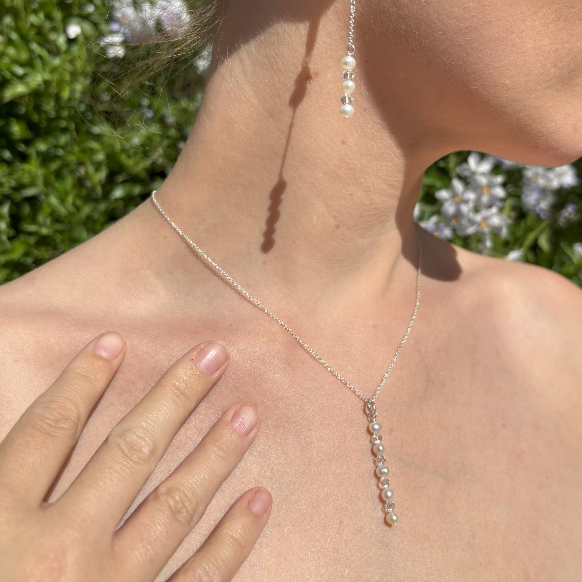 A pearl and crystal necklace  with matching earrings