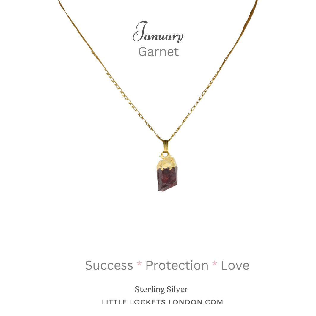 Garnet raw crystal with sterling silver gold tip on sterling silver gold vermeil chain. Mounted on card with the January birthstone, and the crystal name. The card also shows three properties of the garnet - success, protection, love 