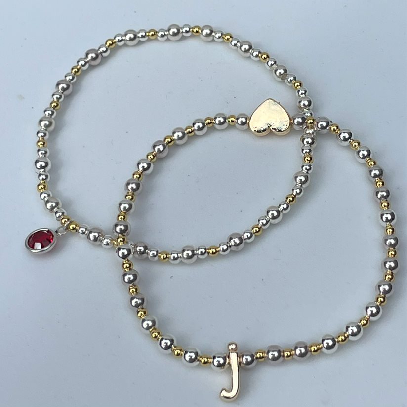 Wear our initial bracelet on its own or stack it with our matching birthstone bracelet. Buy any three Stacker bracelets and receive 10% off. 
