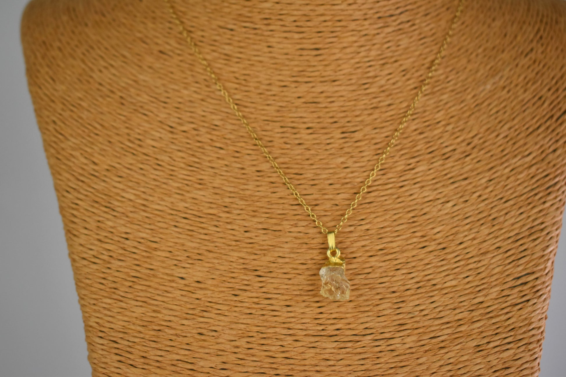 citrine raw crystal shown with sterling silver gold plated tip and suspended from a sterling silver gold plated chain