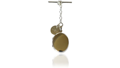 Sterling Silver contemporary Men's Oval Photo Locket. The locket is oval design, can hang from a lapel, inside a jacket pocket, or alongside a buttonhole. Holds up to two photos. Choose between a t-bar or spring clasp.