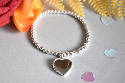 Sterling silver beaded bracelet with opening photo locket