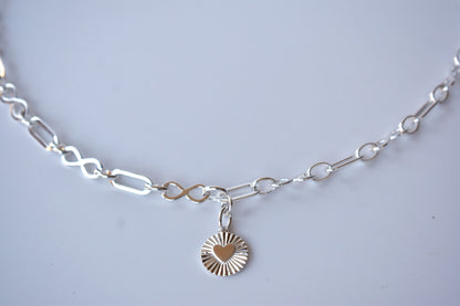 Sterling silver infinity link necklace with sunburst pendant