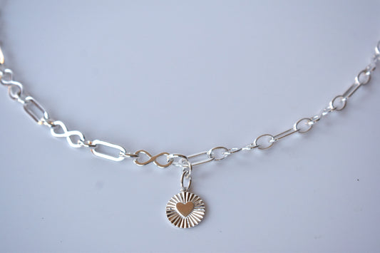 Sterling silver infinity link necklace with sunburst pendant