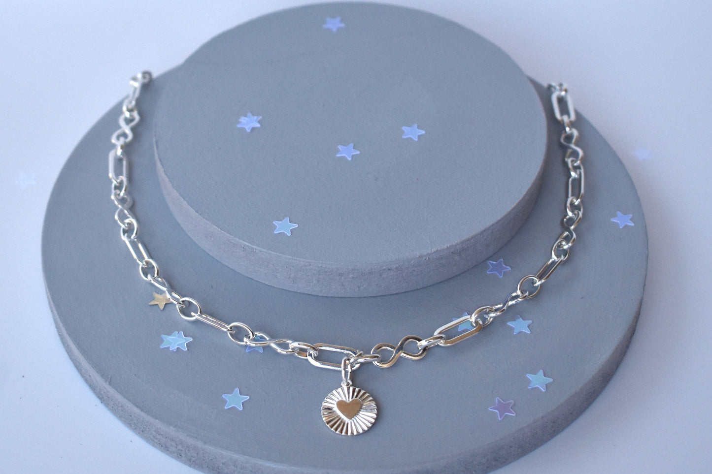 Sterling silver infinity link necklace with sunburst pendant