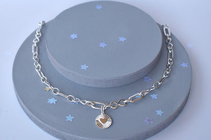 Sterling silver infinity link necklace with sunburst pendant