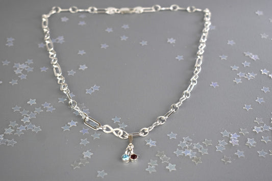 Sterling silver necklace of linked infinity symbols hung with birthstones of your choice