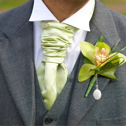 Man wears Engraved sterling silver oval photo locket on chain with t-bar fastening