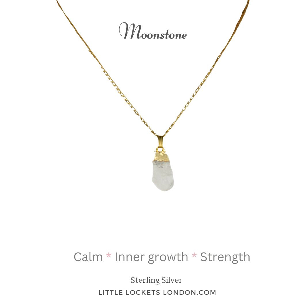 Moonstone pendant with sterling silver gold plated tip suspended from a gold plated sterling silver chain. The pendant is mounted on card with the stone name and three qualities of the stone - calm, inner growth, strength