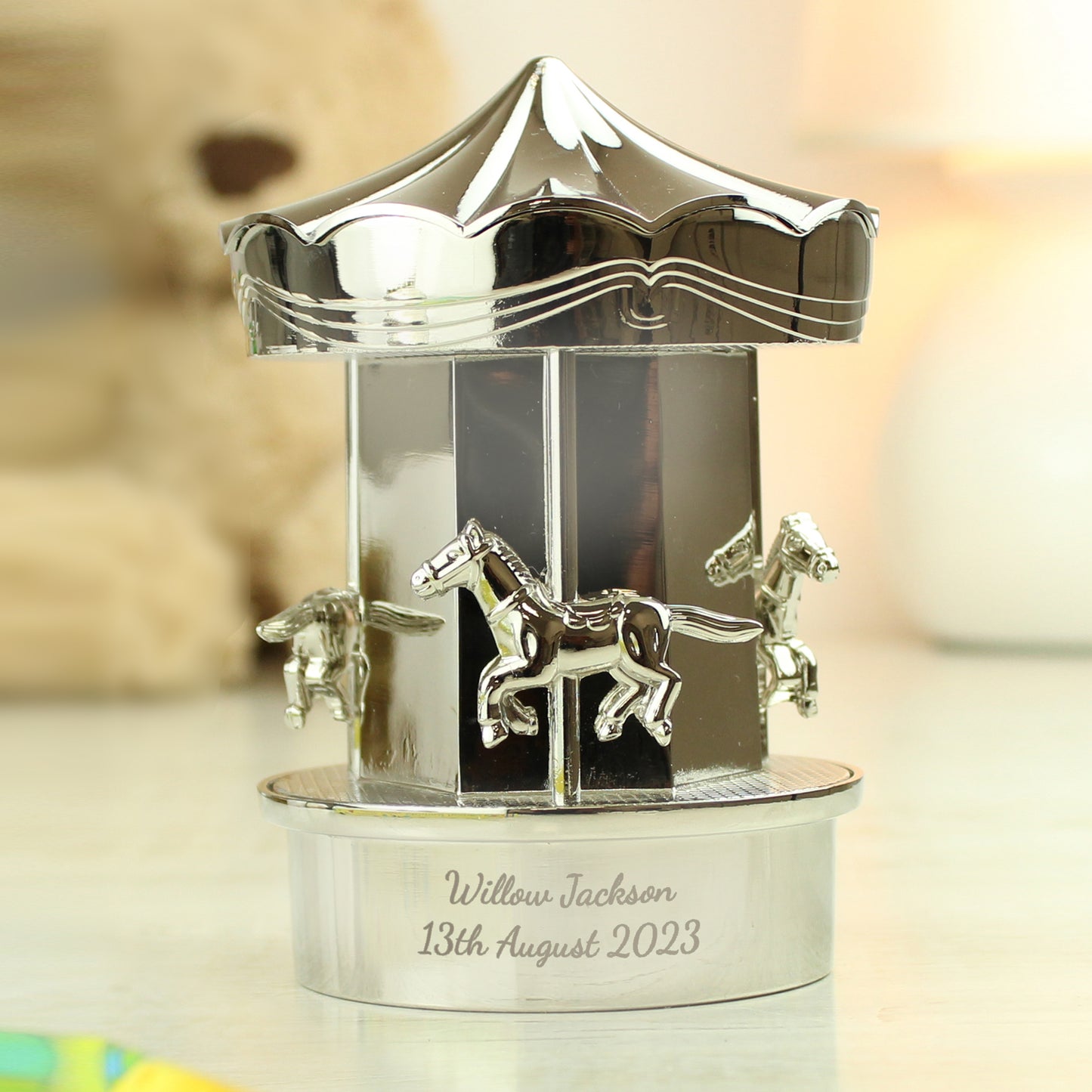 Silver plated carousel ornament with space for your own message at the bottom of the carousel.