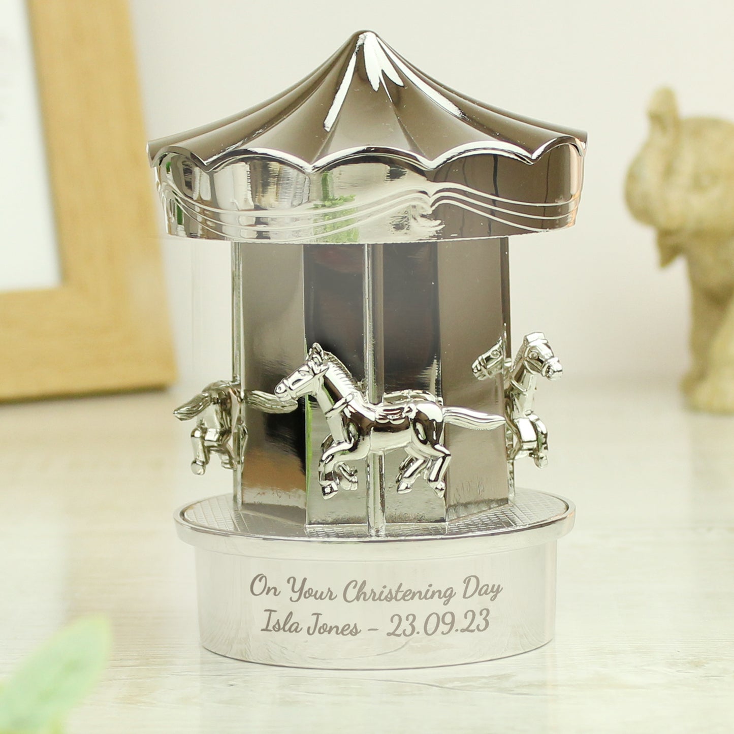 Silver plated carousel ornament with space for your own message at the bottom of the carousel.