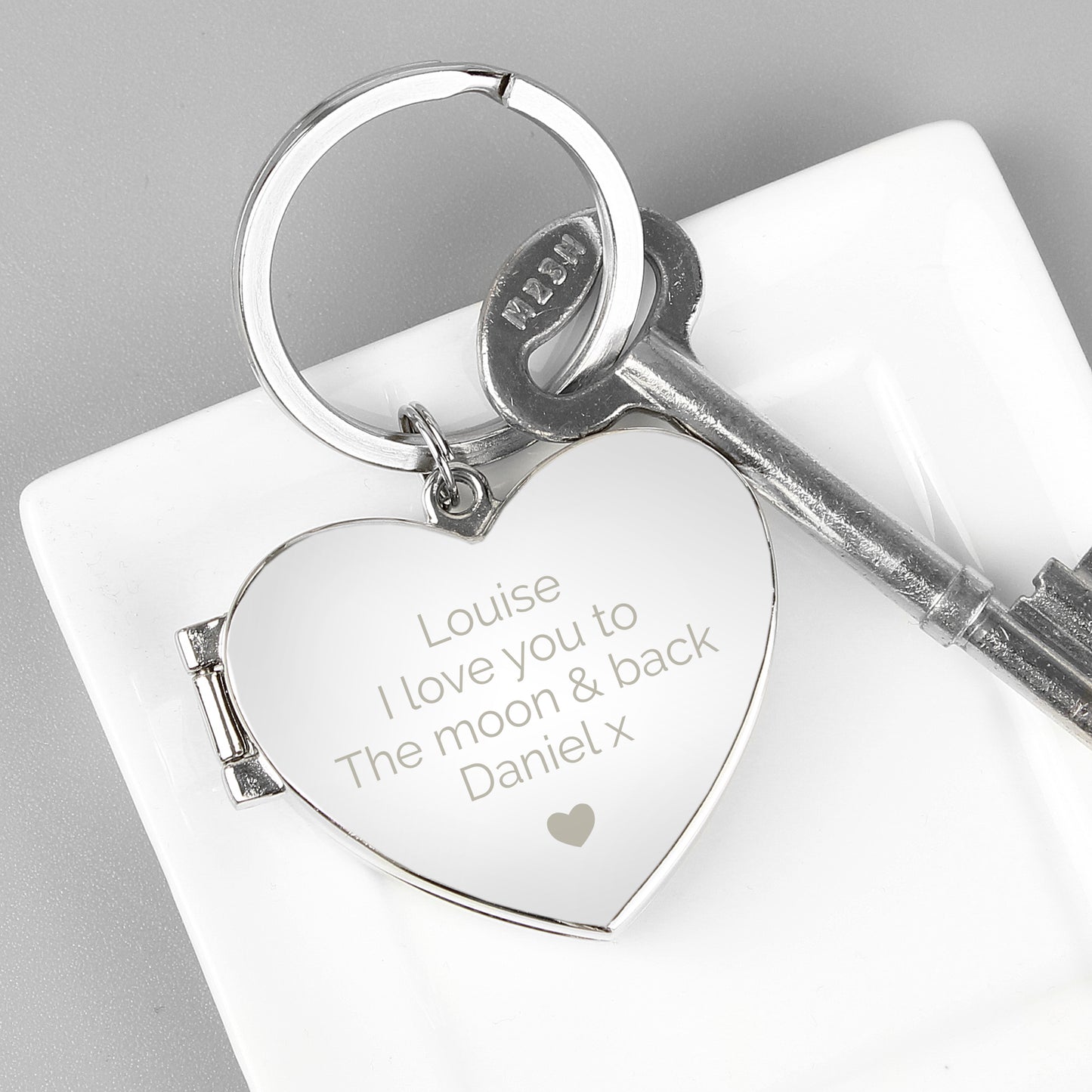 Heart-shaped keychain with your own personalised message above the heart motif.
